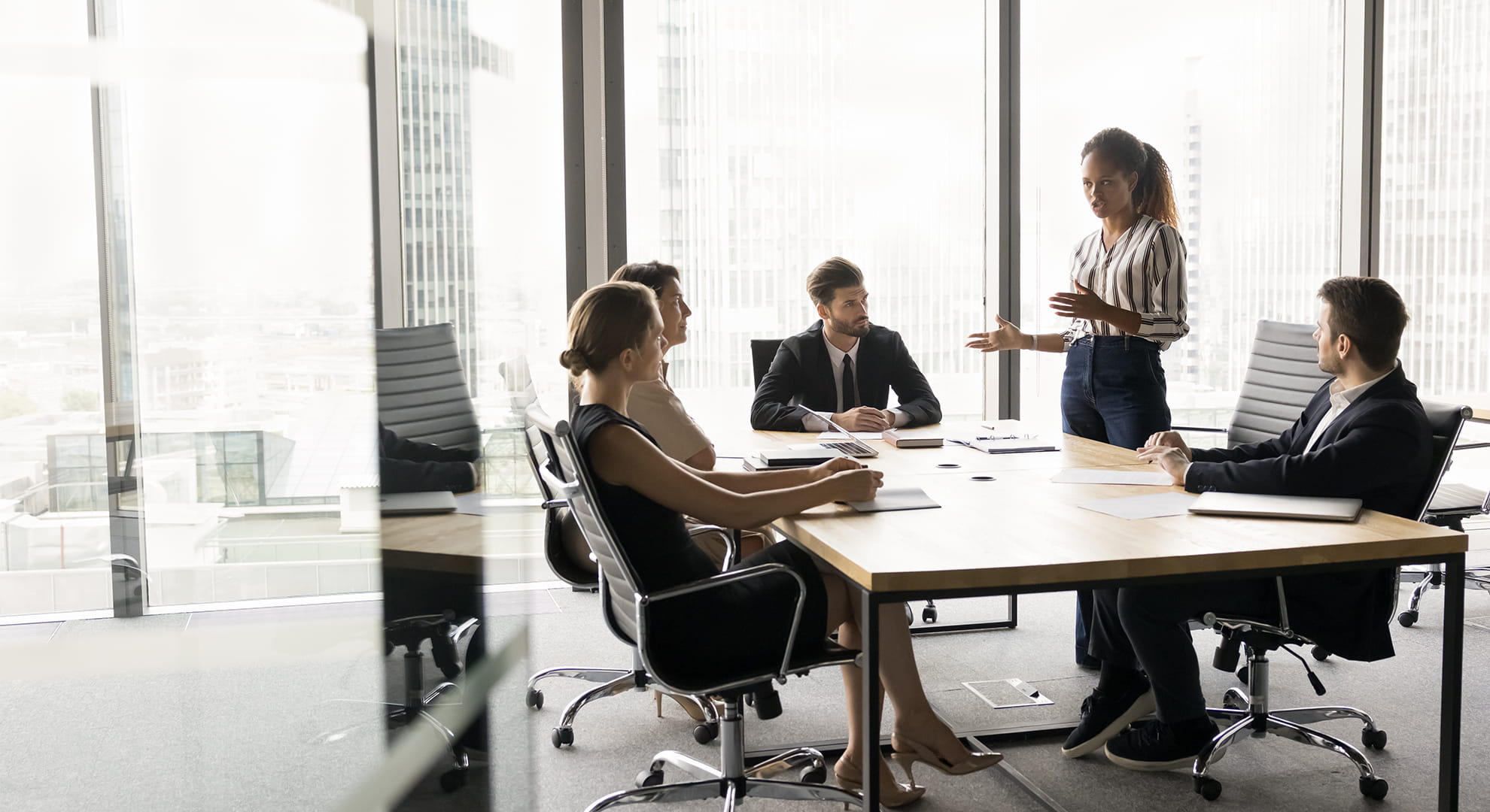 a group of coworkers meeting at a table