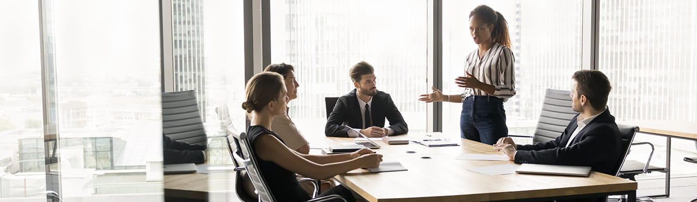 a group of coworkers meeting at a table