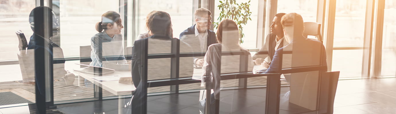 a team sitting at a table for a business meeting