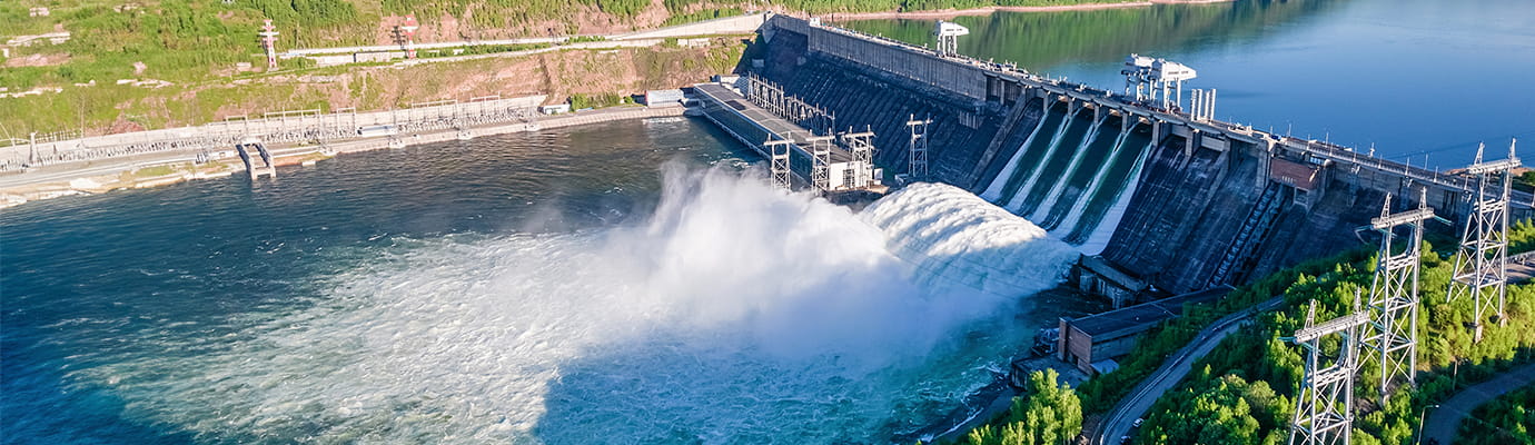 A water dam surrounded by trees