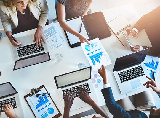 overhead shot of a team working at a table