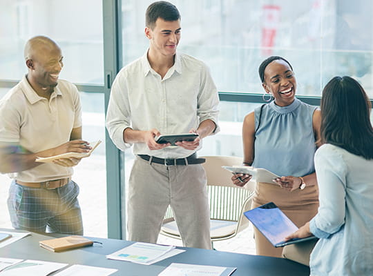coworkers talking around a table