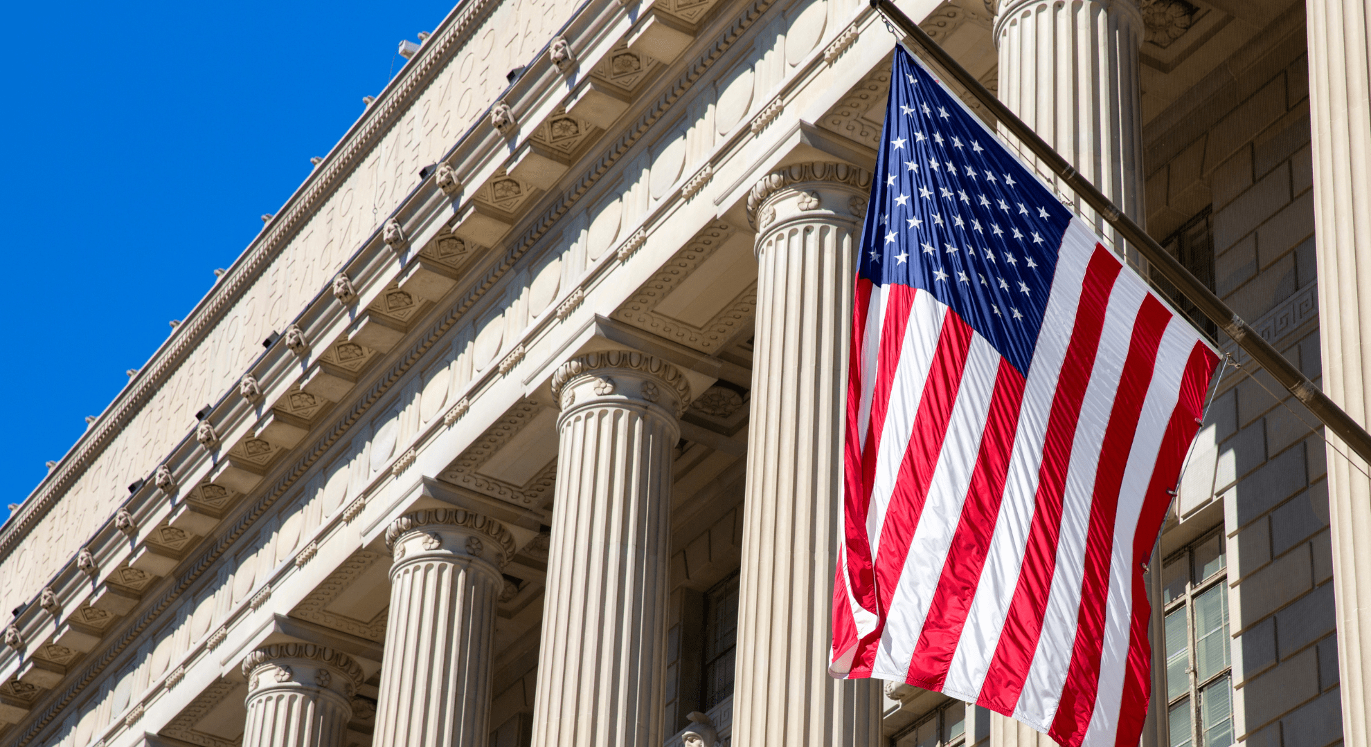 american flag on a government building