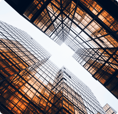 upward looking perspective of two orange buildings