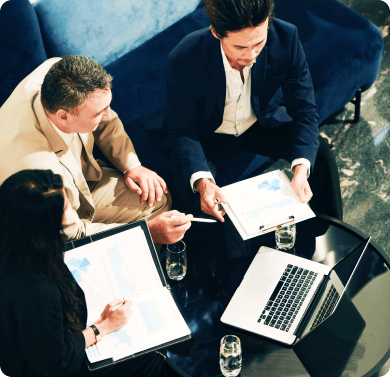 a team of professionals working together at a desk